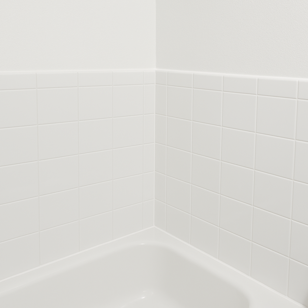The same bathroom corner with fresh caulk, clean grout, and repainted drywall after remediation